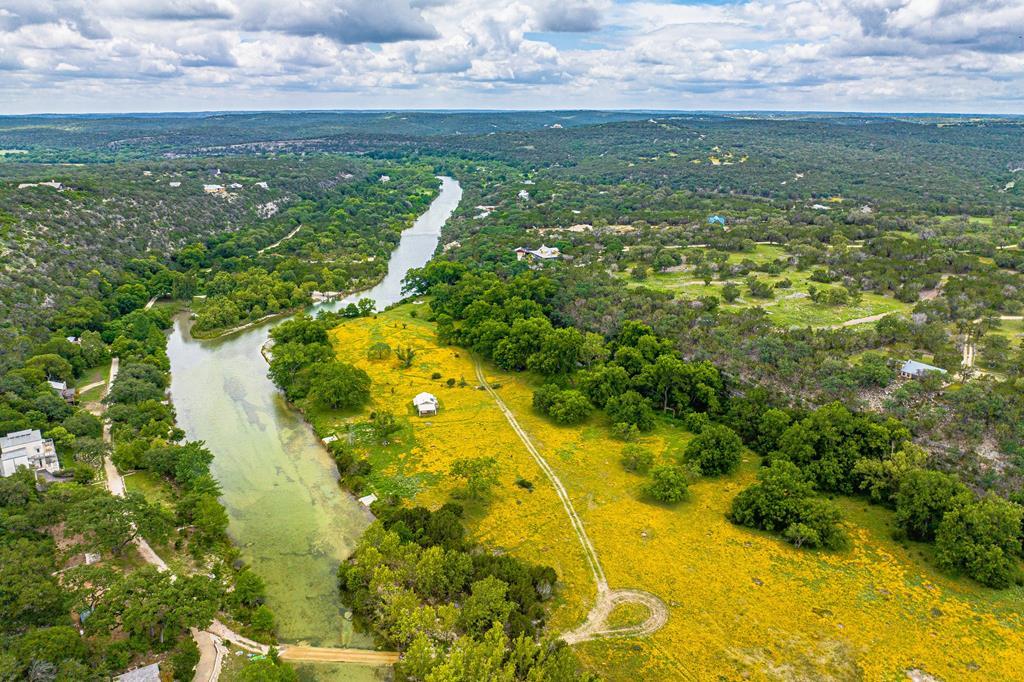 a view of a lake with a big yard