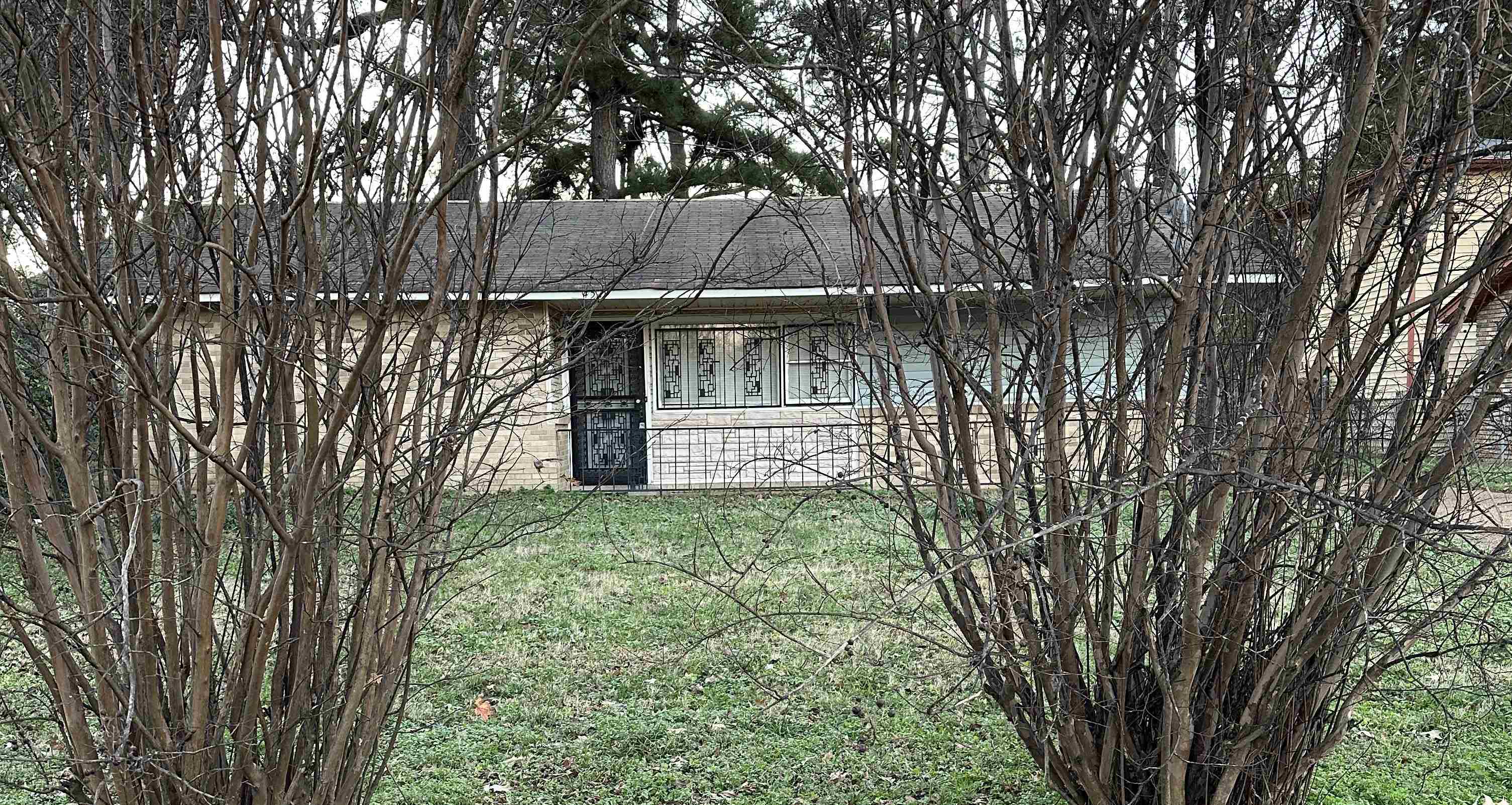 View of home's exterior with a yard