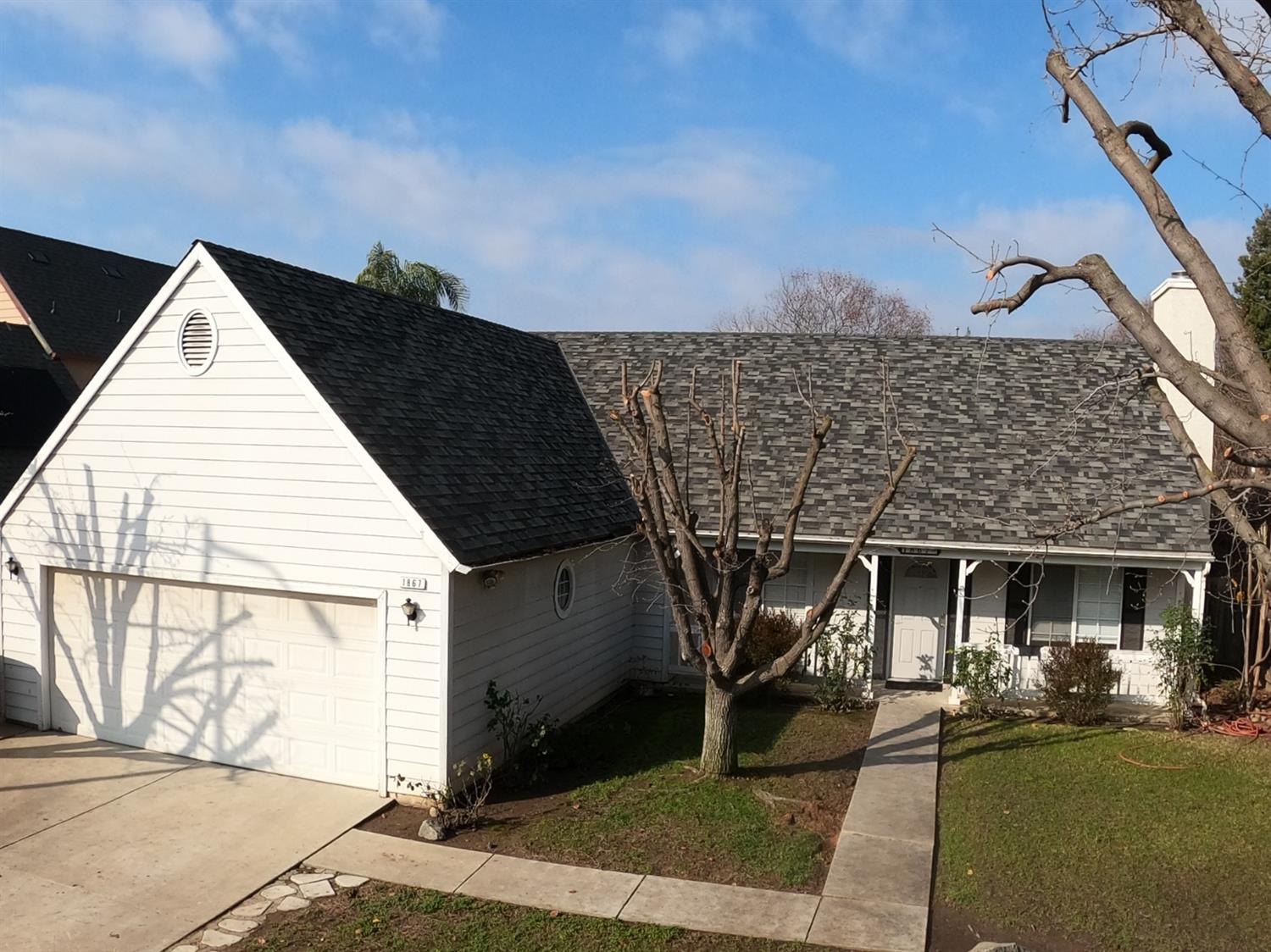 a front view of a house with a yard