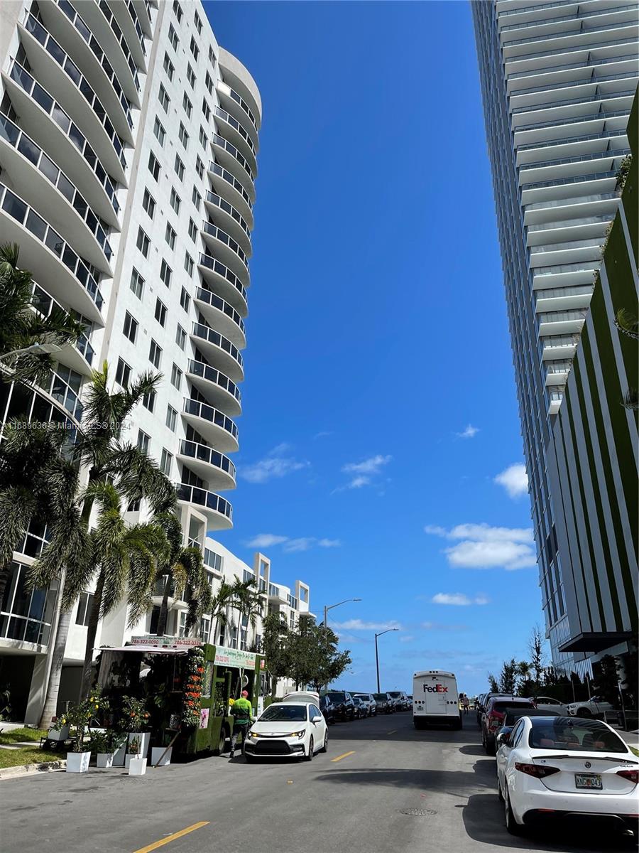 a view of a street with cars