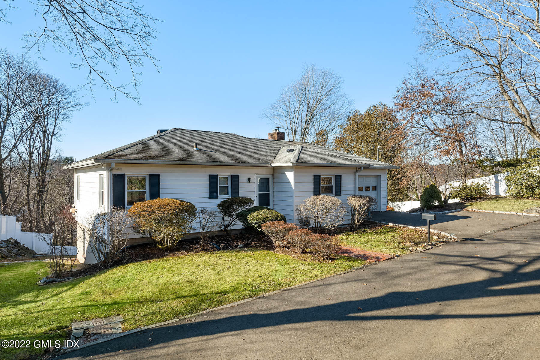 a front view of multiple houses with yard