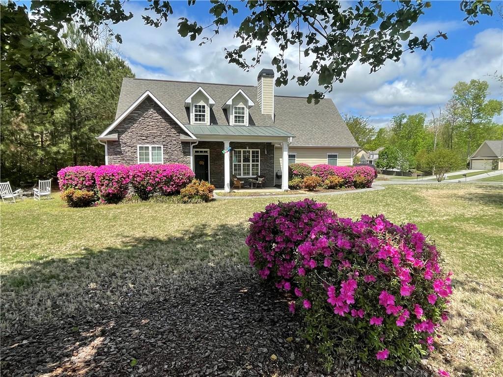 a front view of a house with yard