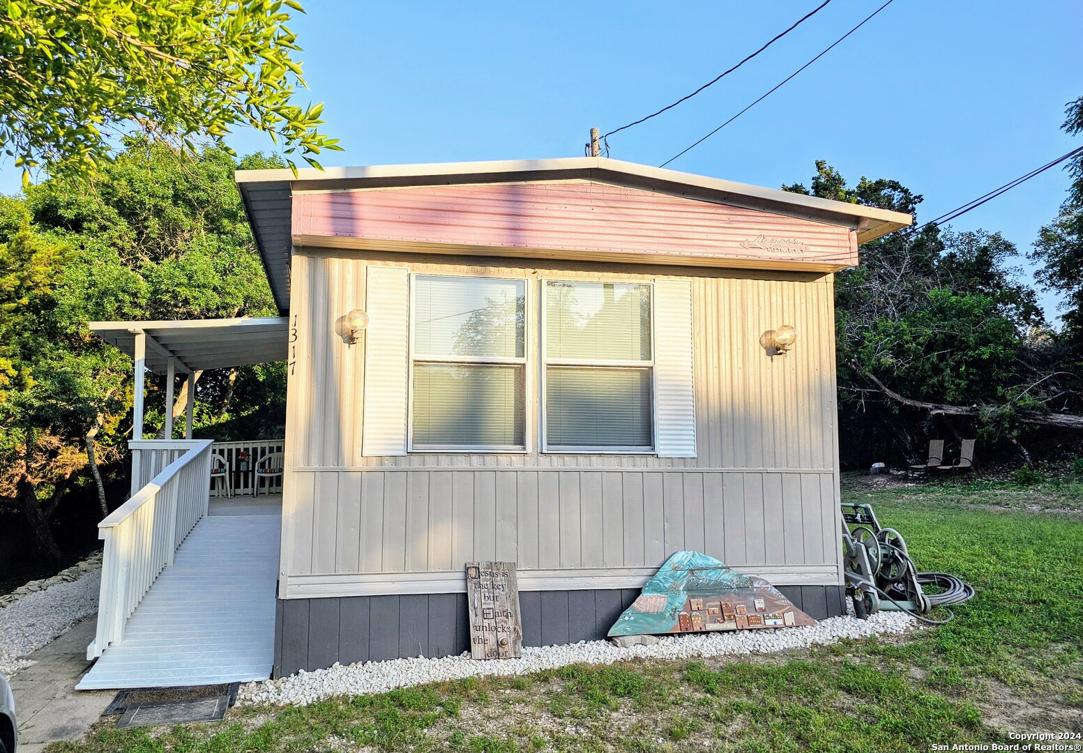 a view of house with backyard