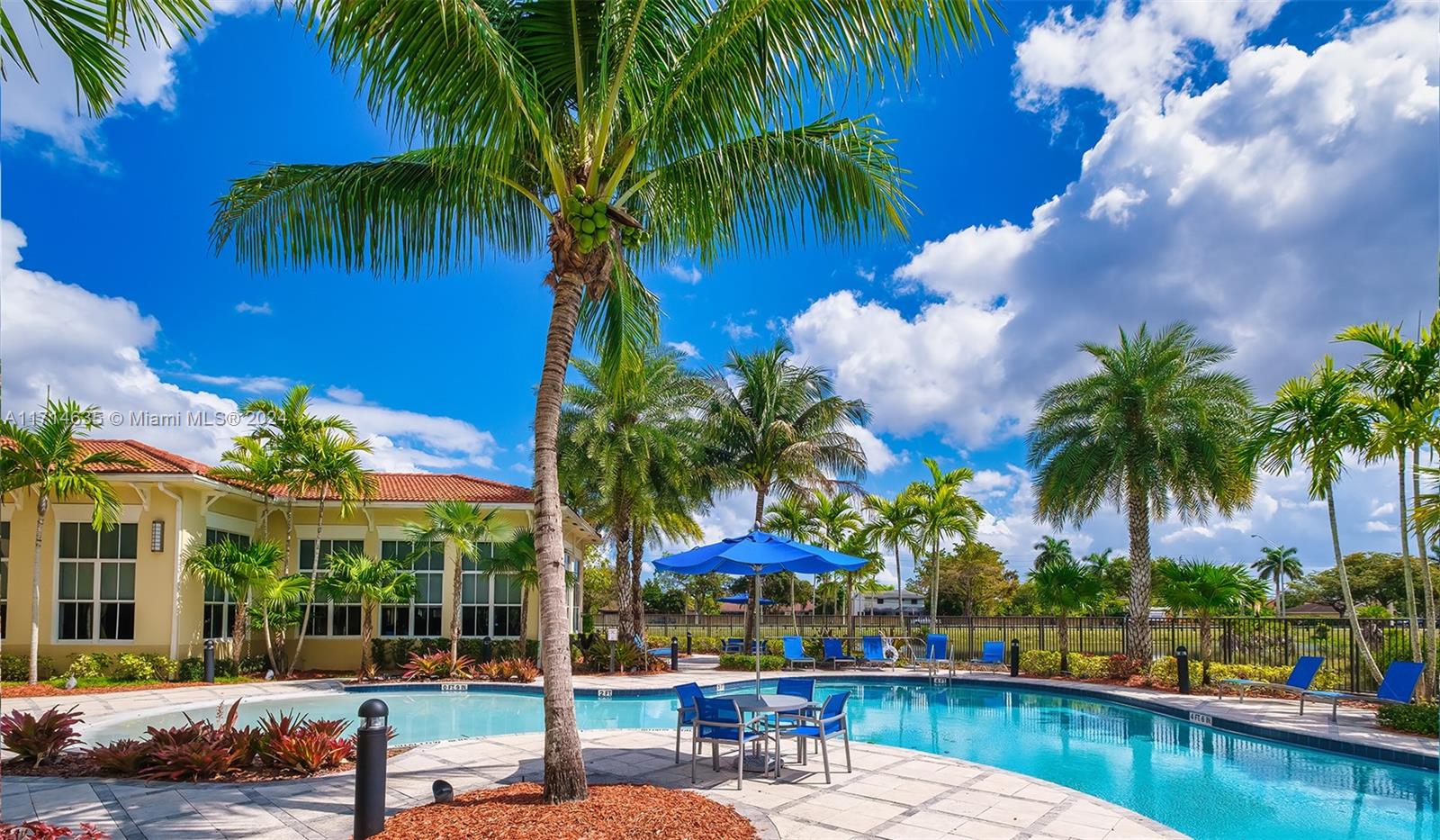 a swimming pool with outdoor seating and yard