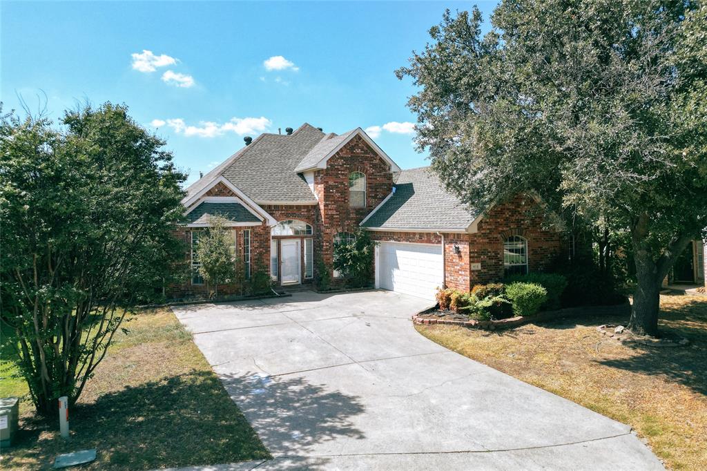 a front view of a house with yard