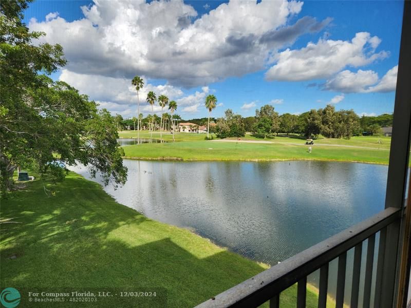 a view of a lake with a big yard