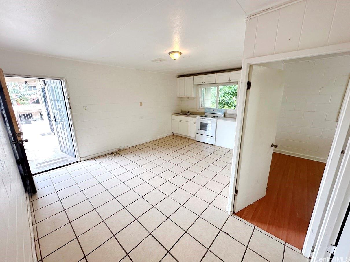 a view of kitchen with furniture and wooden floor