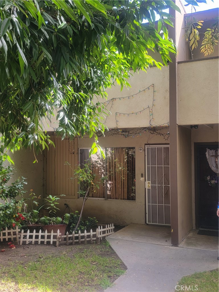 a view of a house with a yard balcony and swimming pool