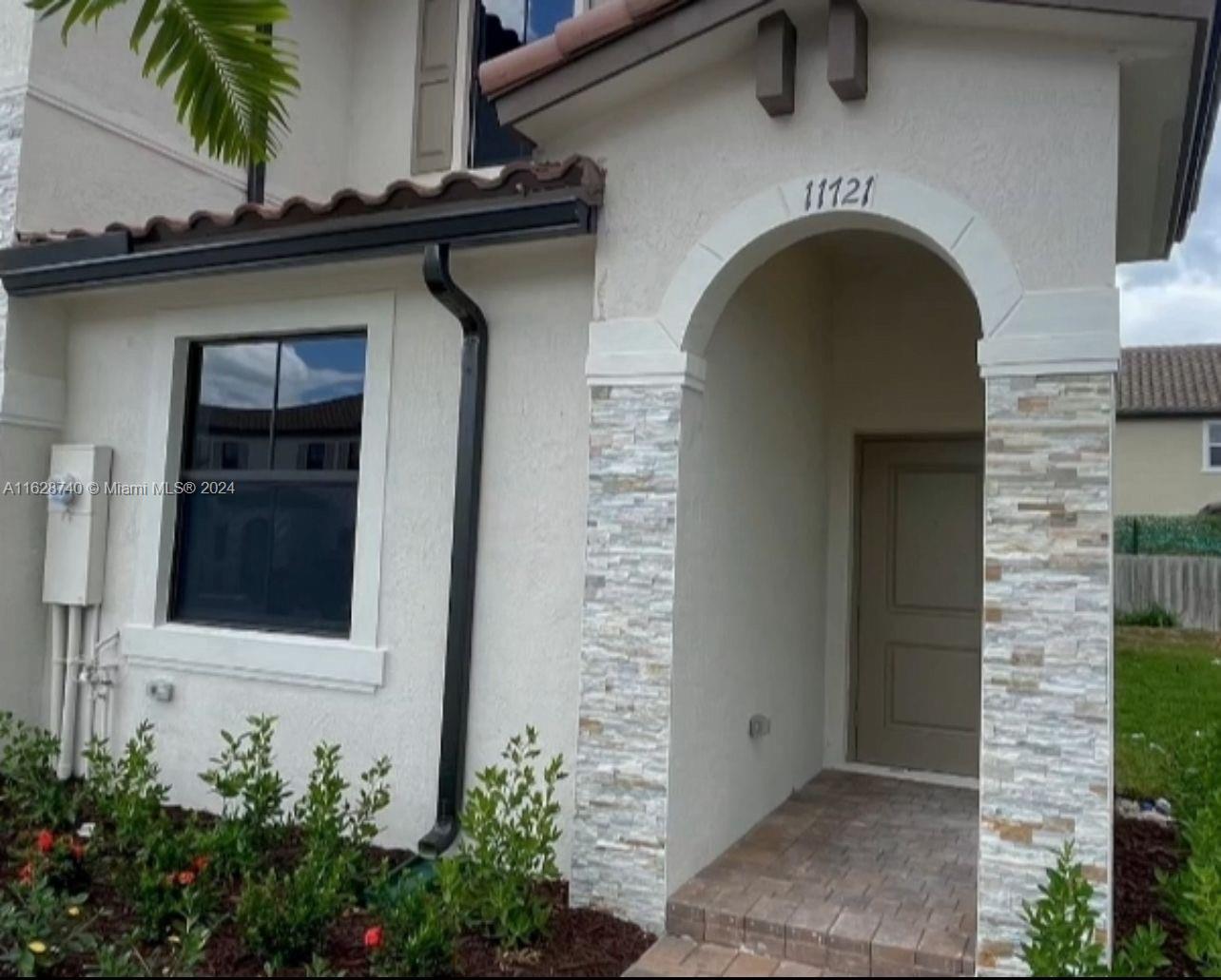 a front view of a house with a shower