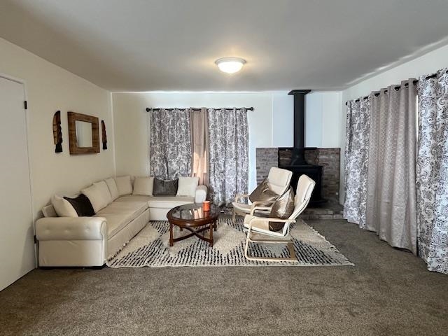 a living room with furniture a couch and a window