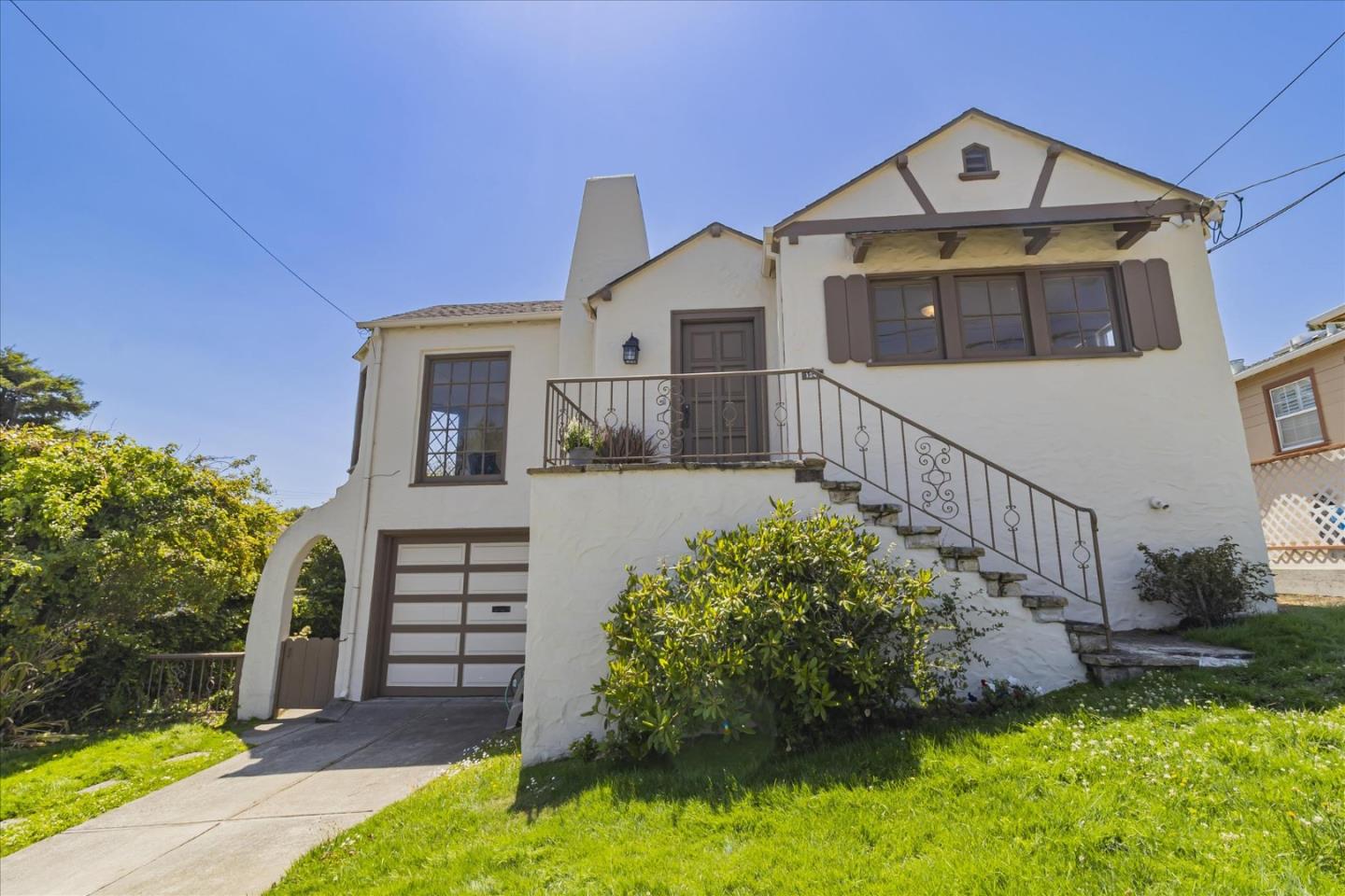 a front view of a house with a yard