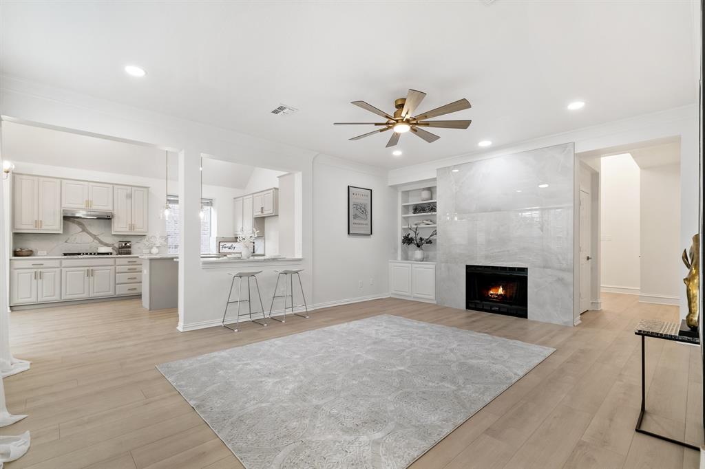 a view of a kitchen with furniture and a fireplace