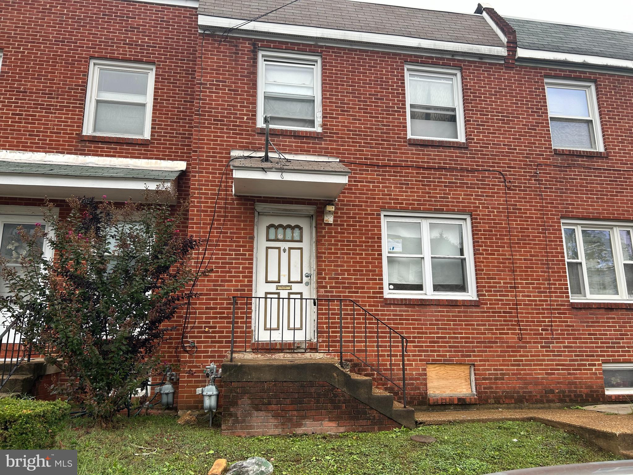 a front view of a house with yard