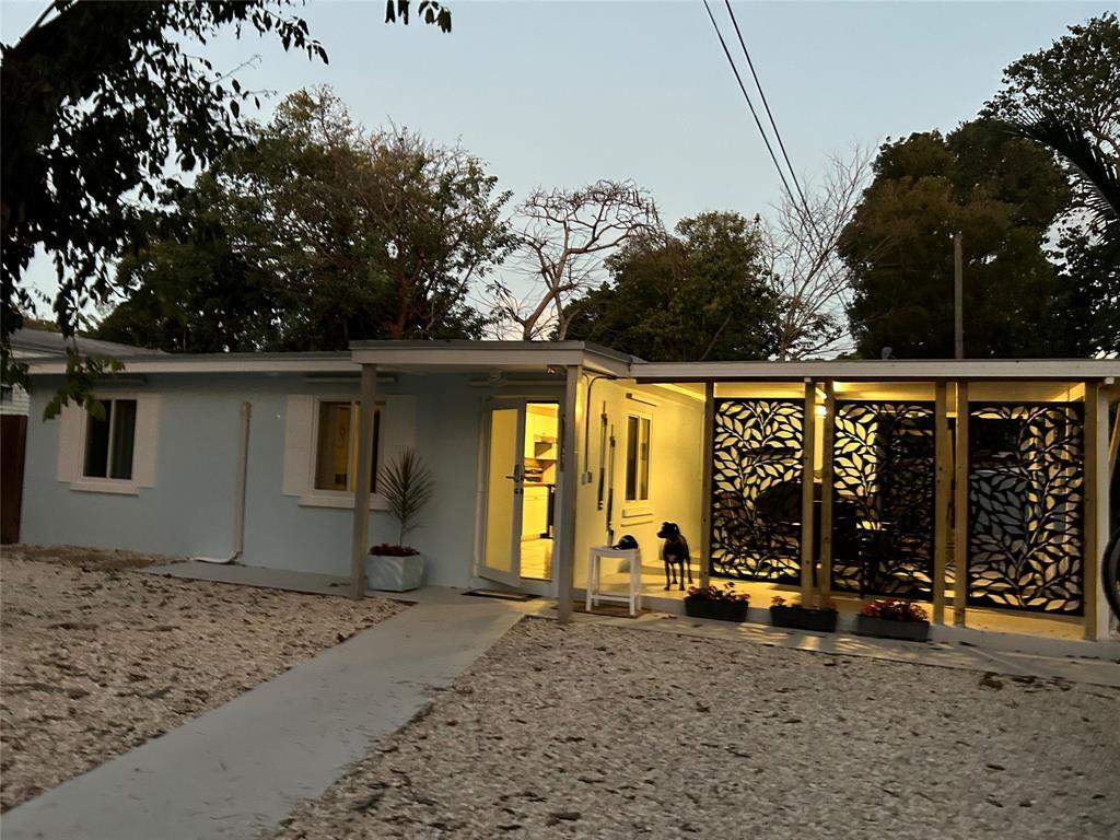 a view of a house with porch and sitting area