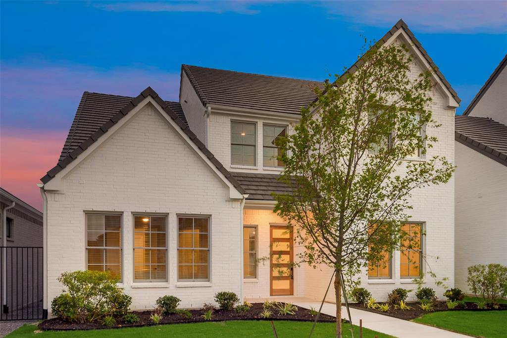 front view of a house with an trees