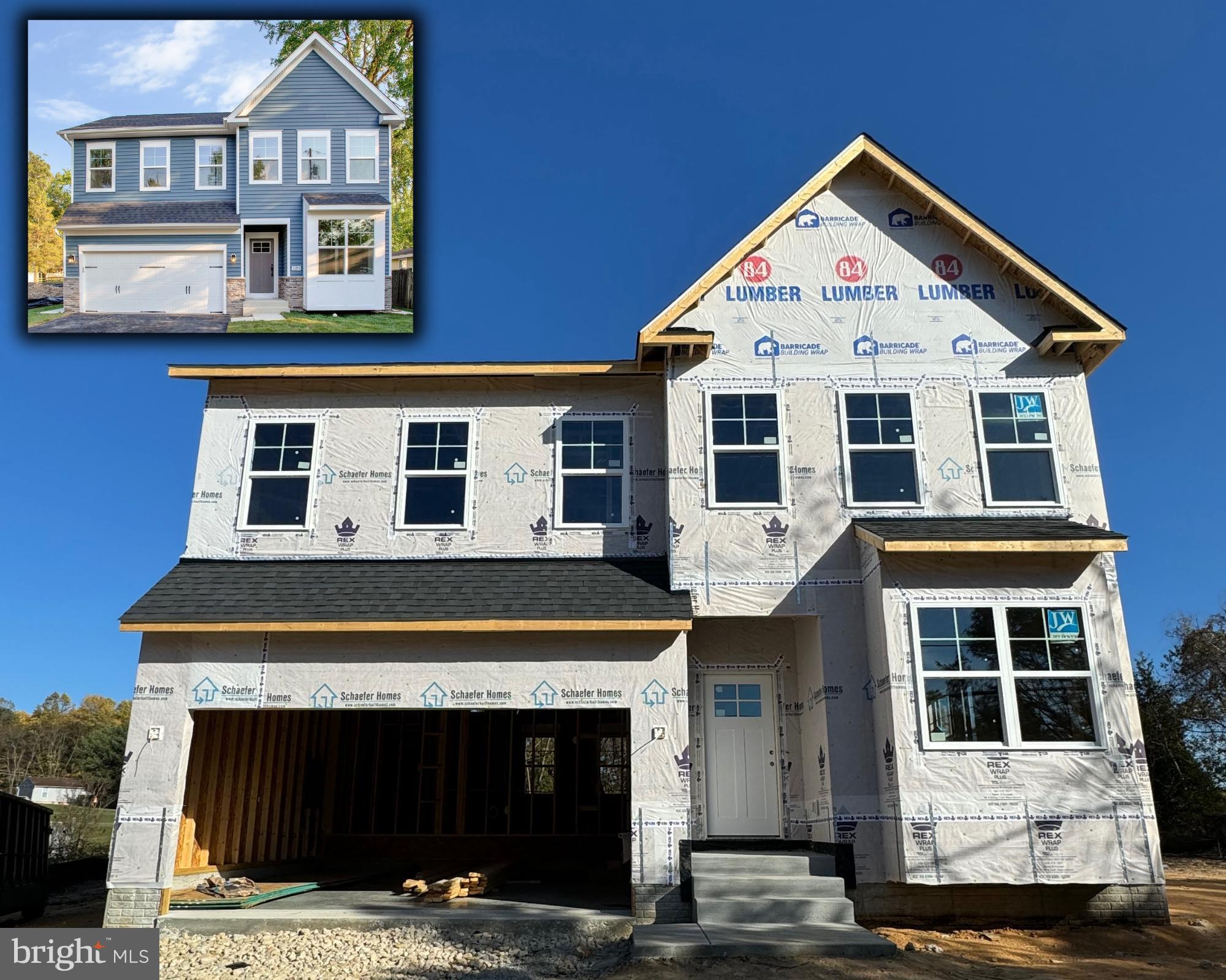 a front view of a house with a garage