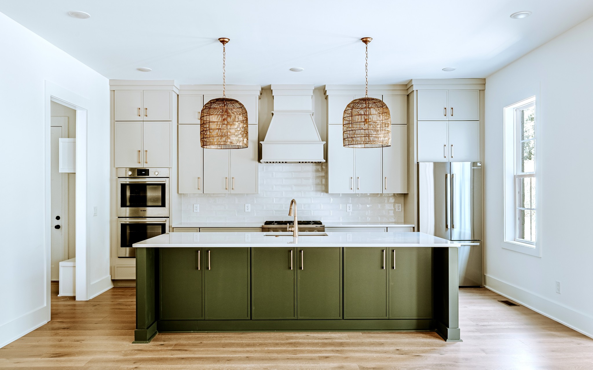 a view of kitchen with granite countertop stainless steel appliances cabinets and wooden floor