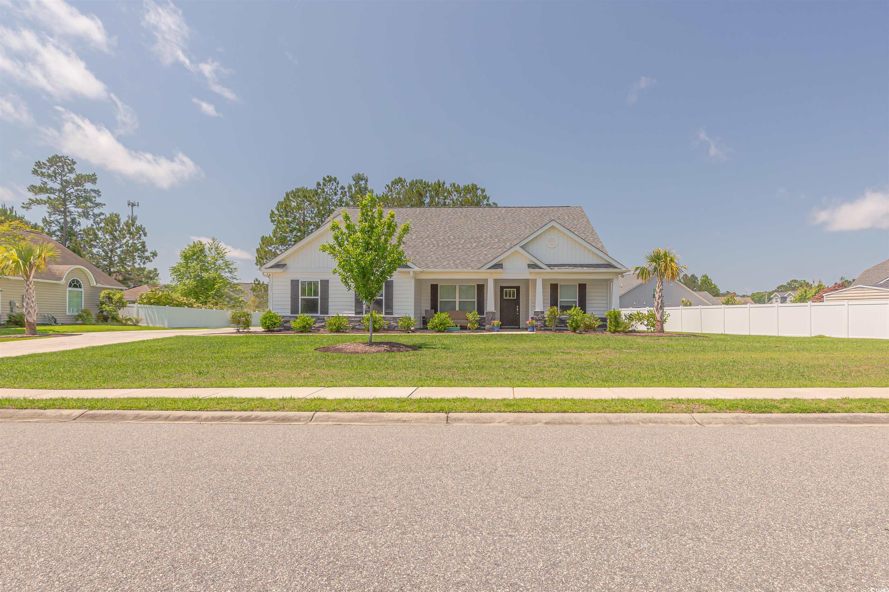 View of front of property with a front yard