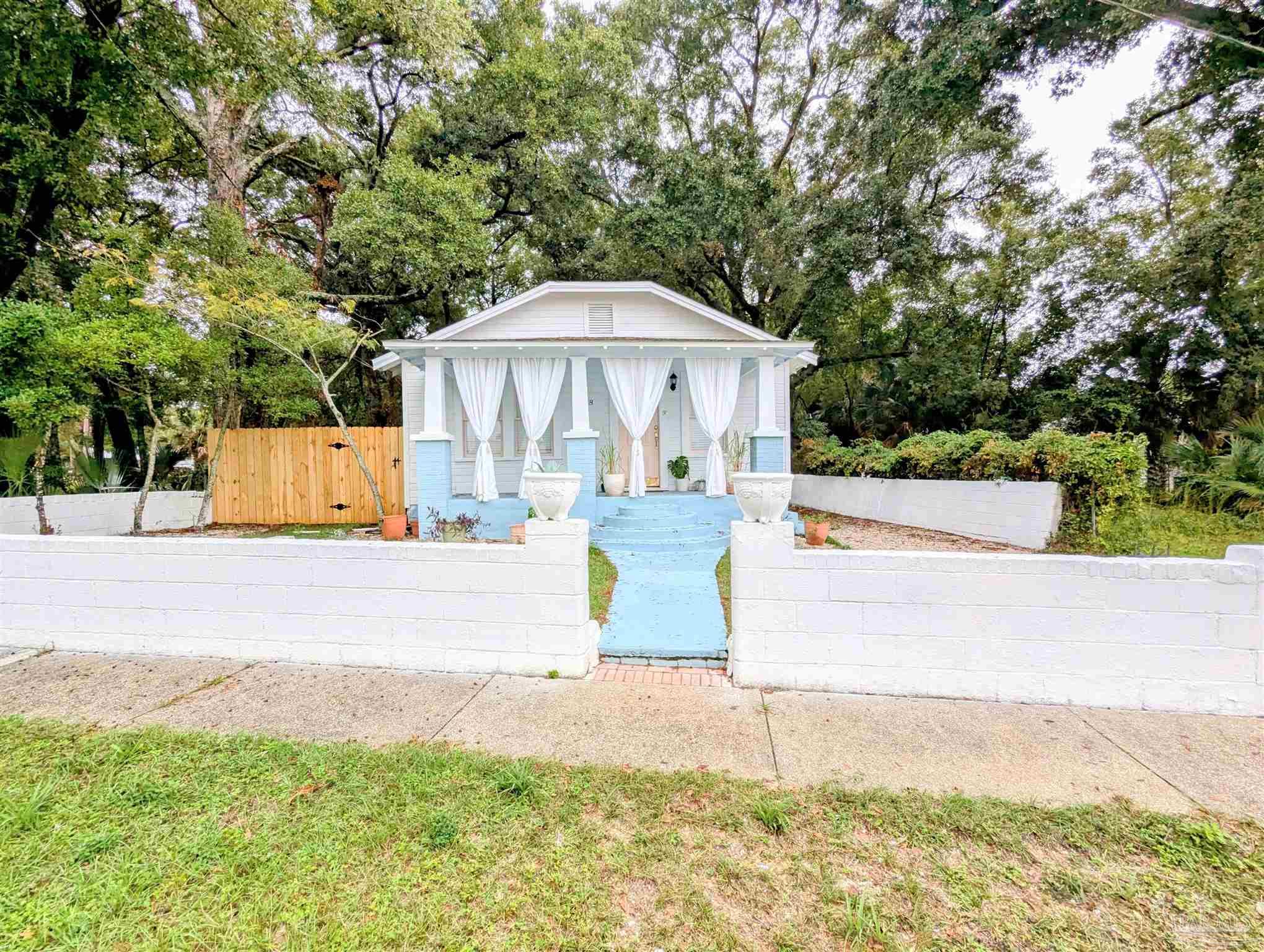 a view of a water fountain in the middle of a yard