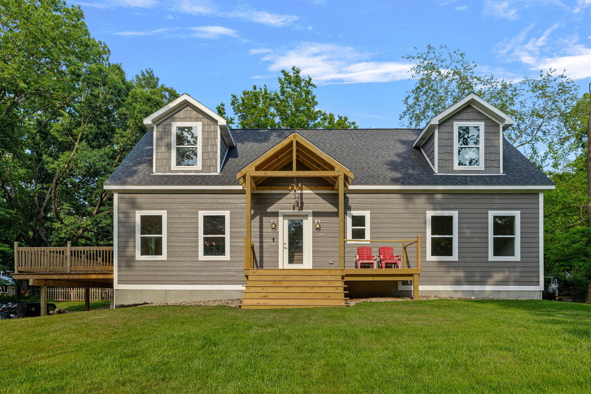 a front view of a house with a garden