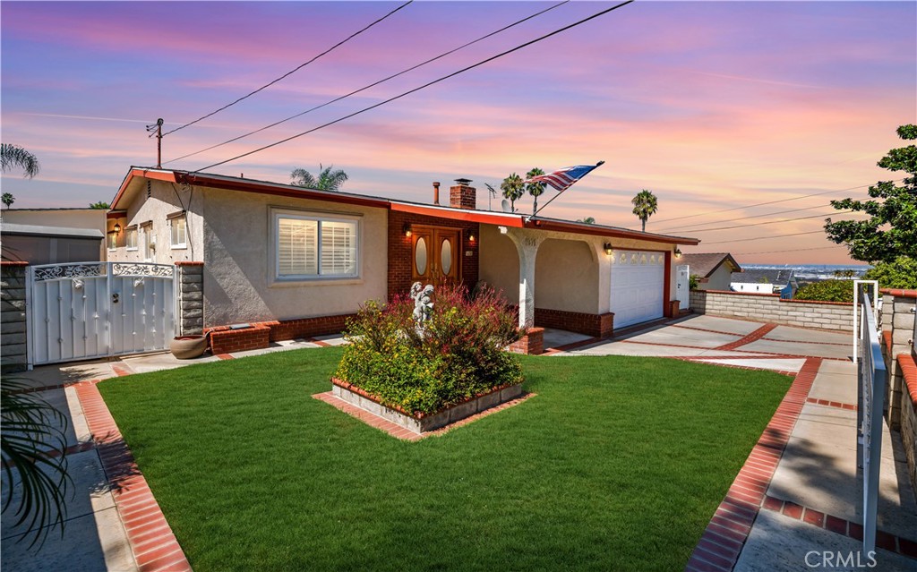 a front view of house with yard and outdoor seating