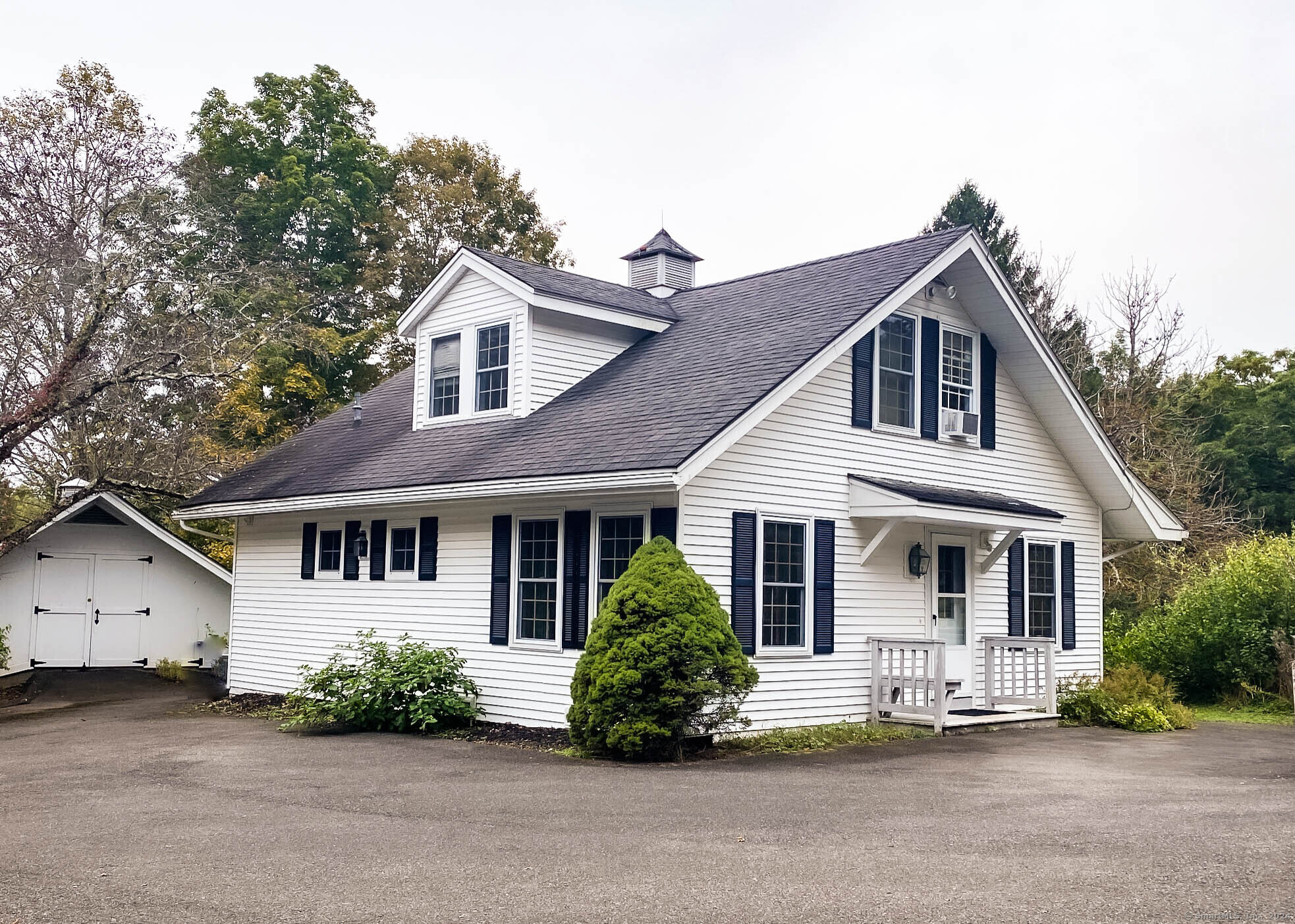 front view of a house with a garden