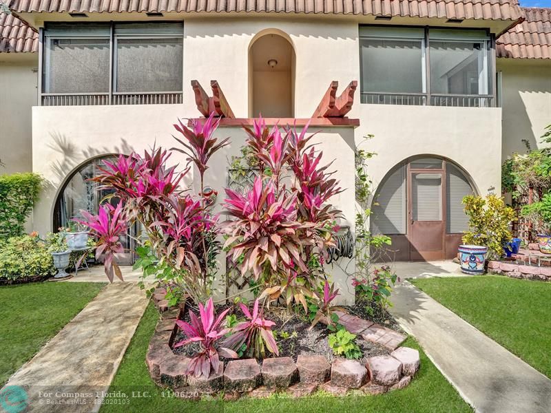 a front view of a house with yard