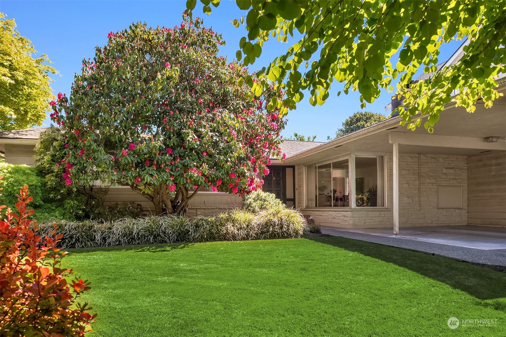 a view of a house with a garden