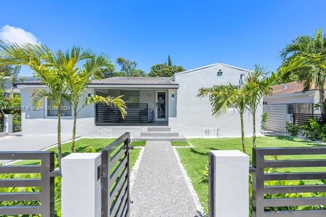 a front view of a house with garden