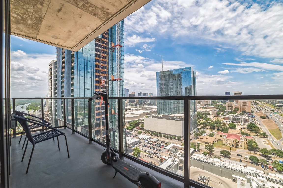 a view of balcony with furniture