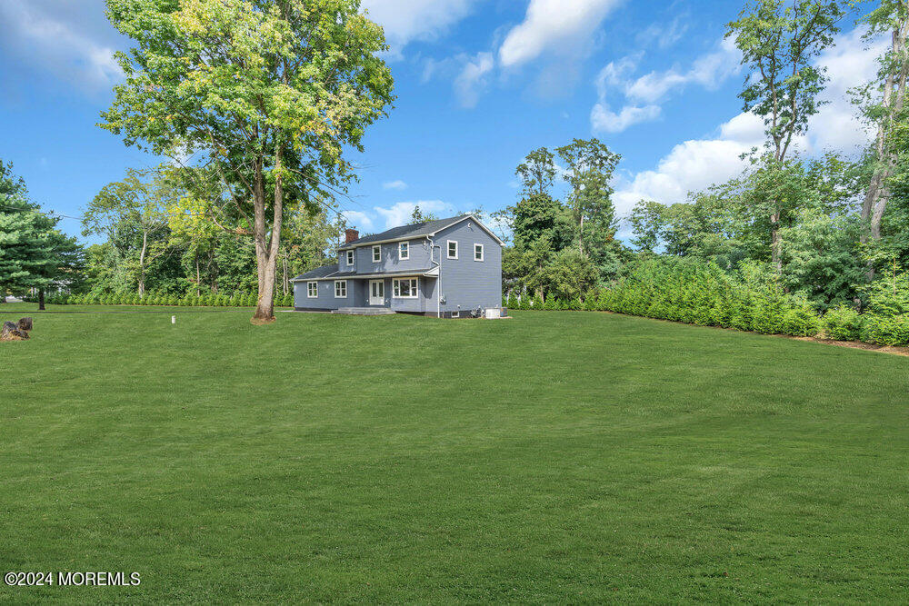 a view of a house with a big yard