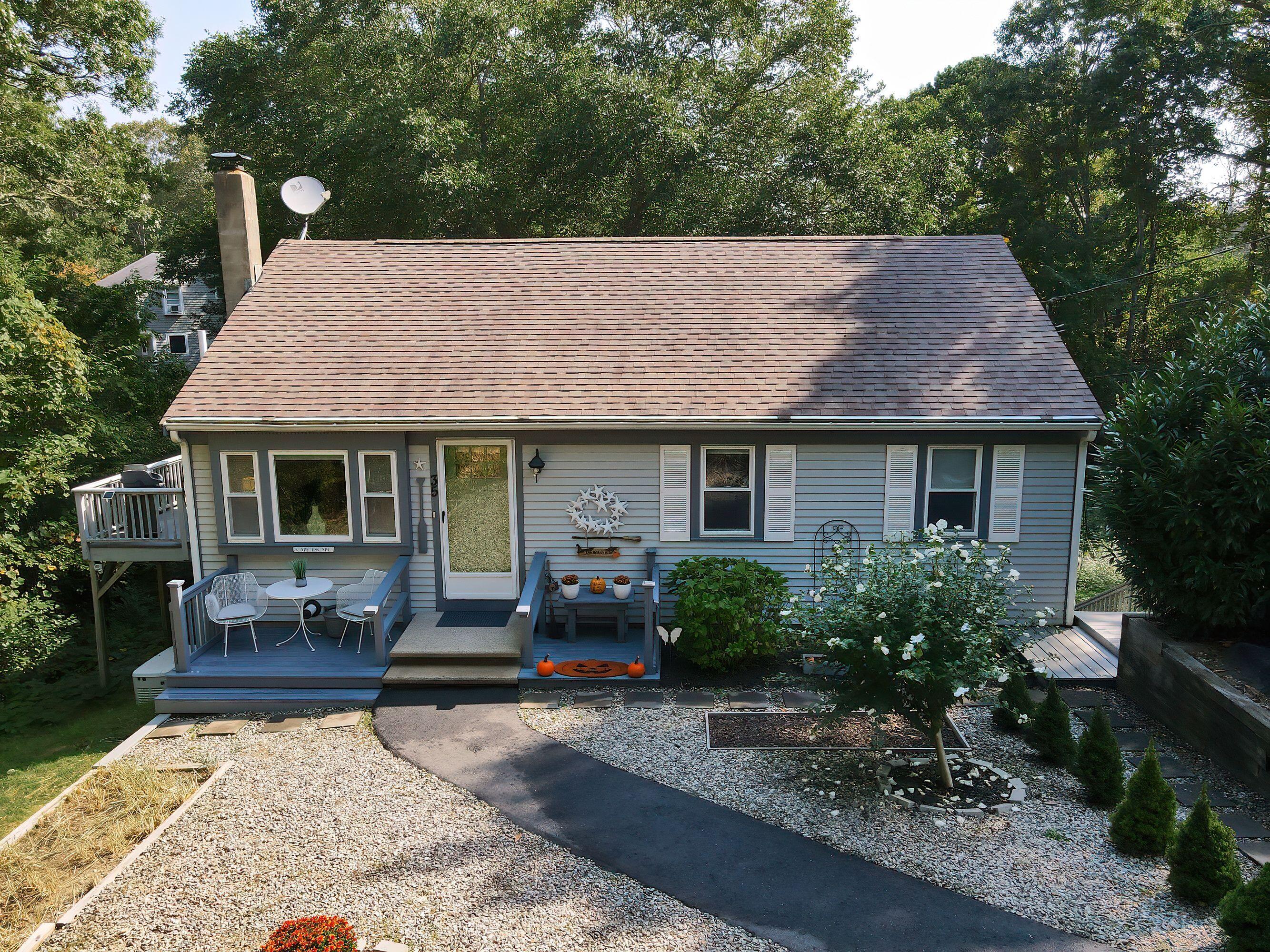 a front view of a house with garden