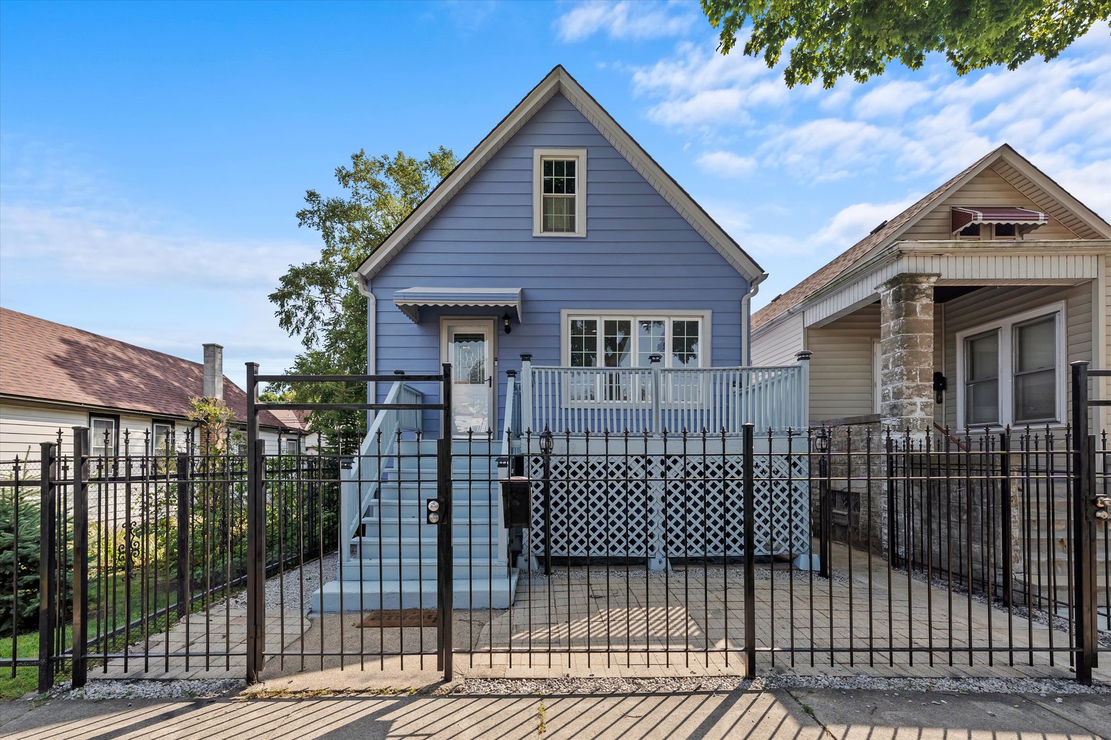 a view of a house with wooden deck