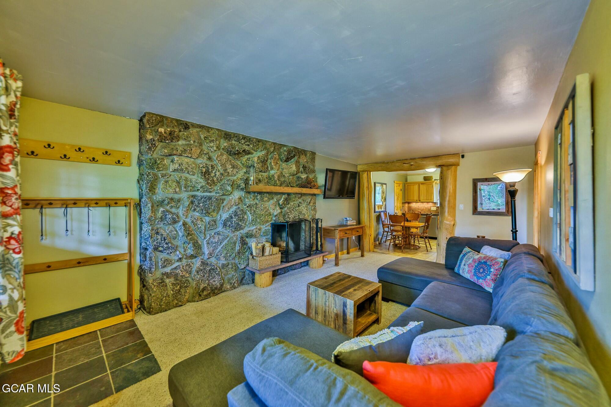 Living room with wood burning fireplace