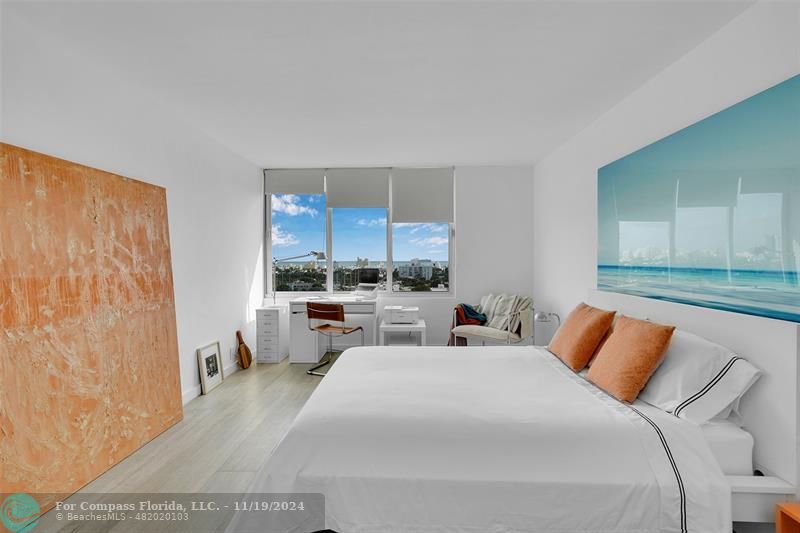 Bedroom is bright and spacious, offering breathtaking South Beach city views and featuring impact-resistant windows.  The spacious layout of the room provides plenty space for a desk and chair, making it a perfect setting for both relaxation and productivity.