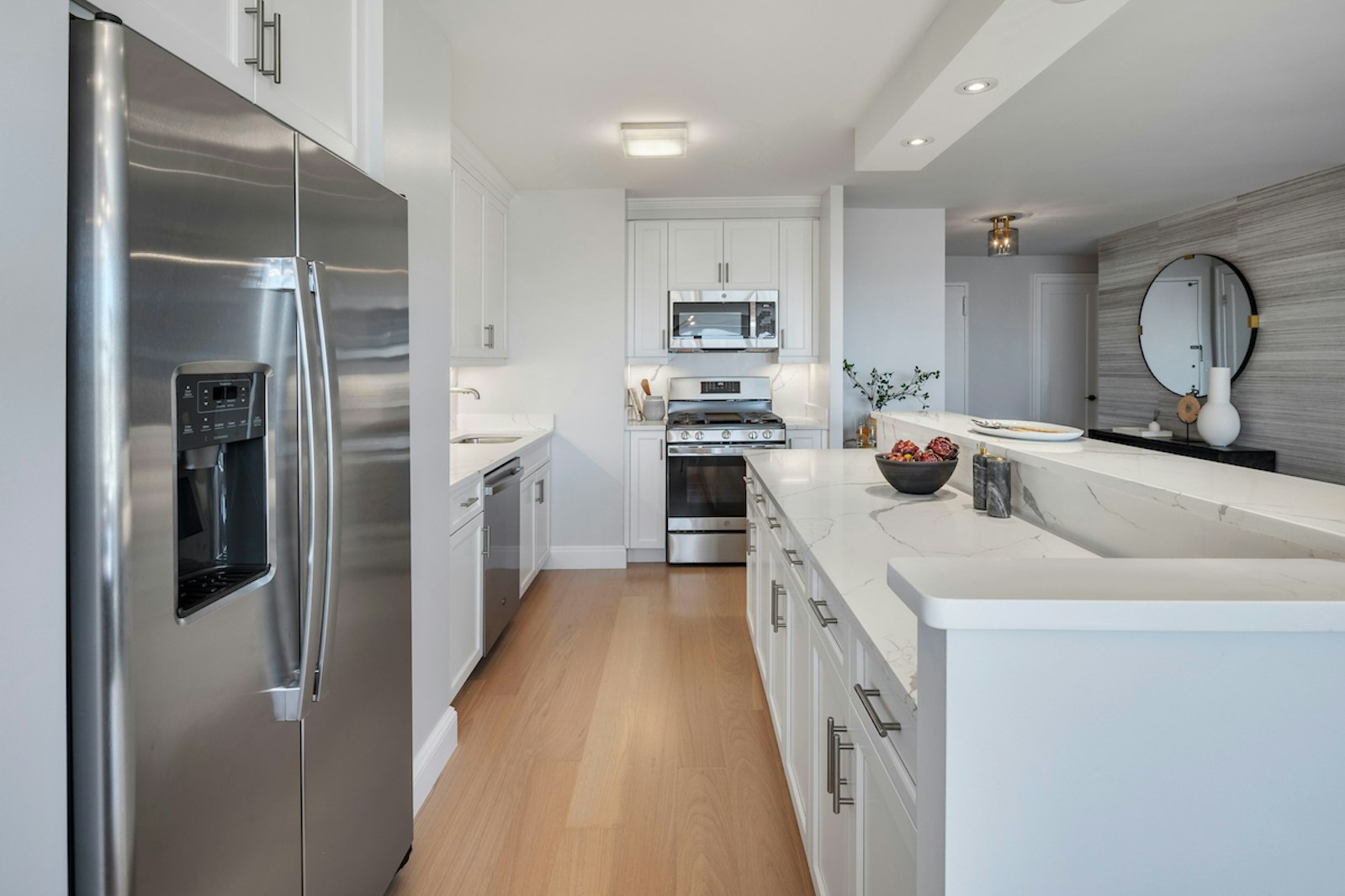 a kitchen with a sink and a refrigerator