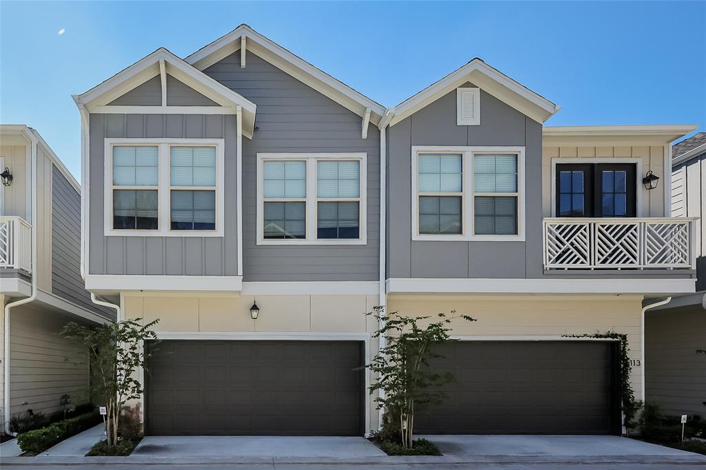 a front view of a house with a garage