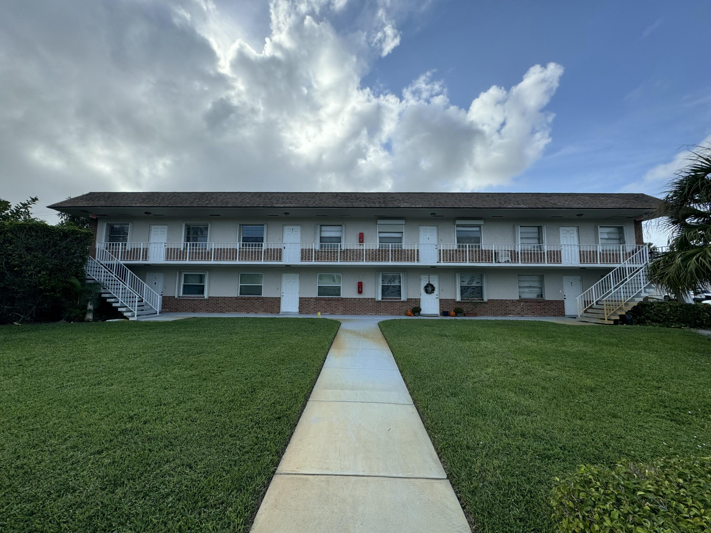 a view of house with yard