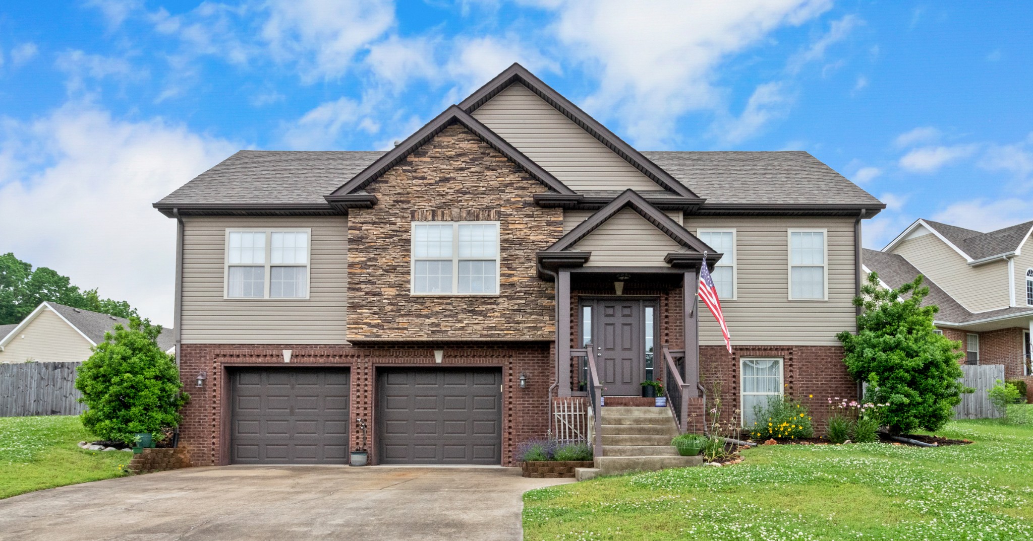 a front view of a house with a yard