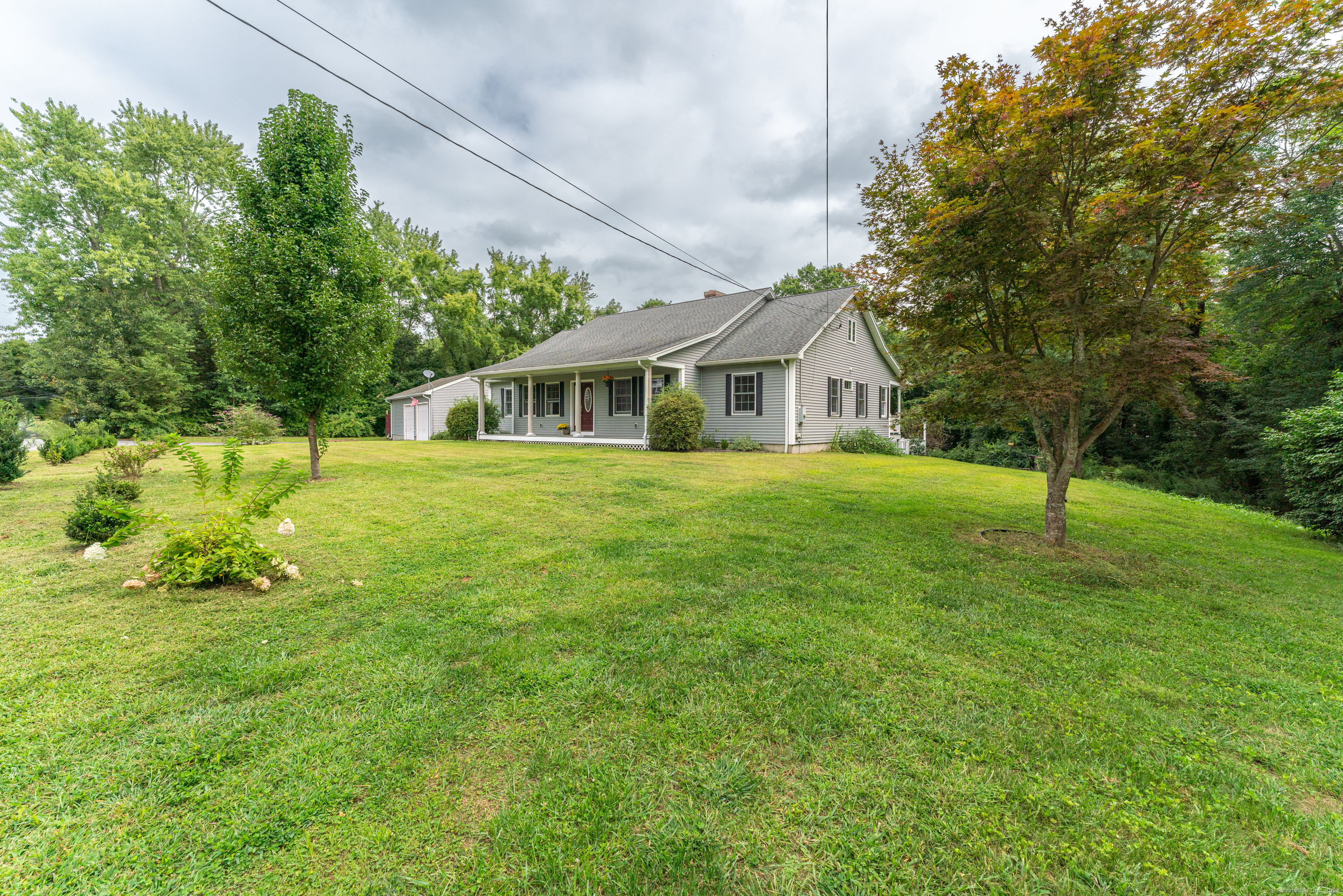 a front view of a house with a yard