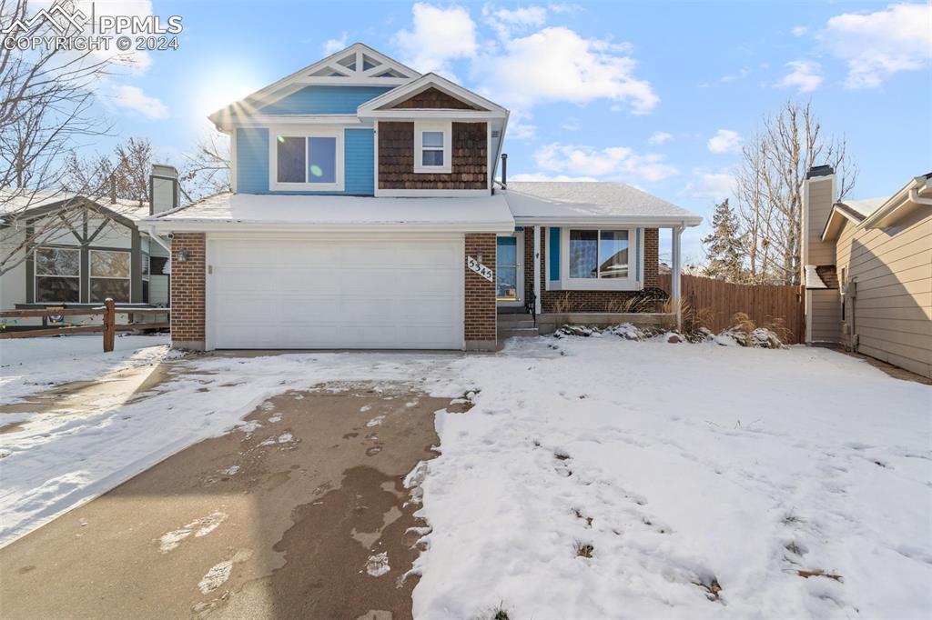 View of front of property with a garage