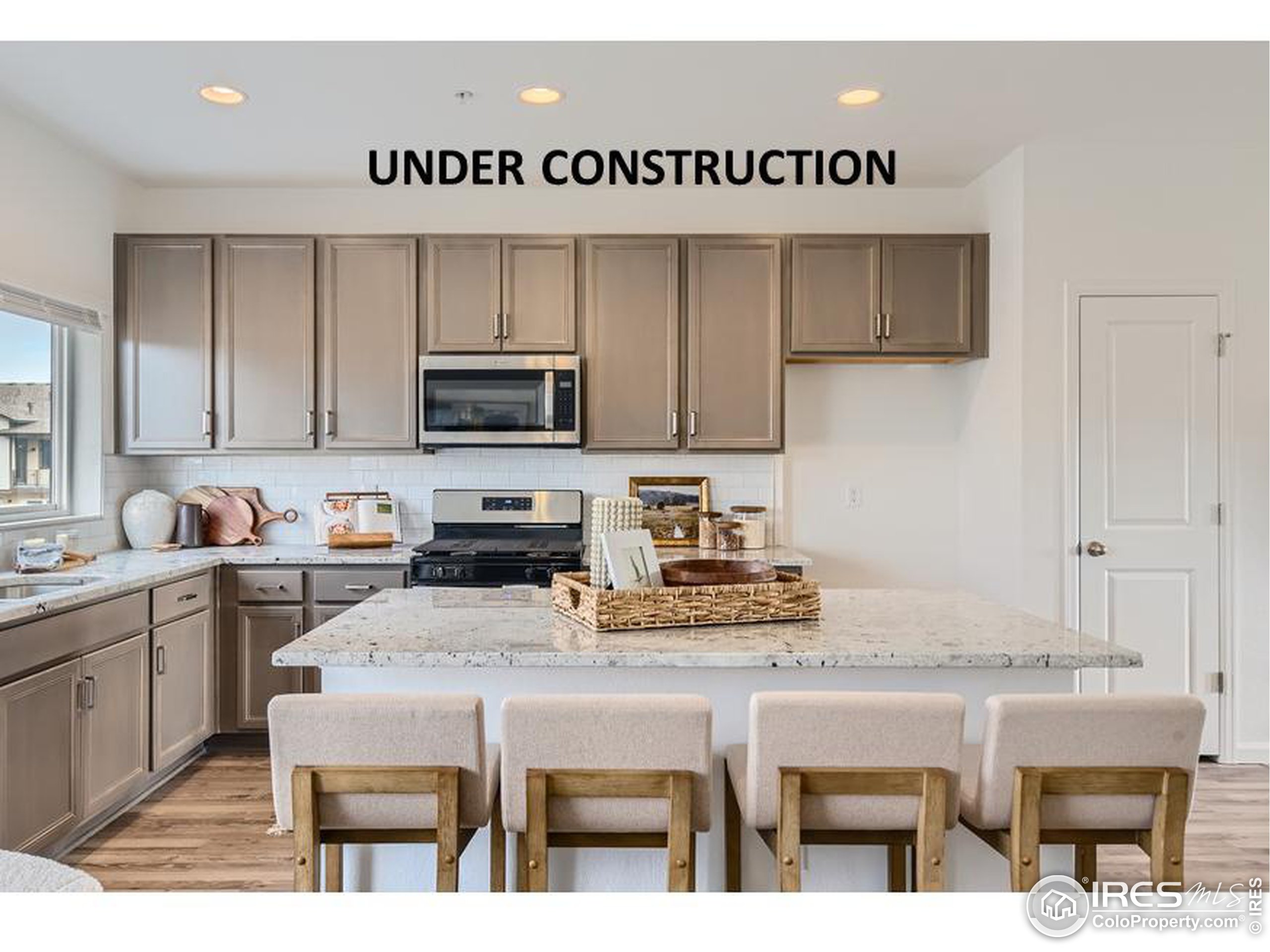 a kitchen with a dining table and chairs