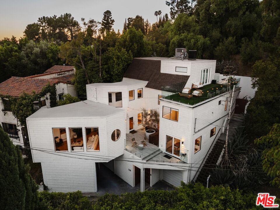 a aerial view of a house with a yard