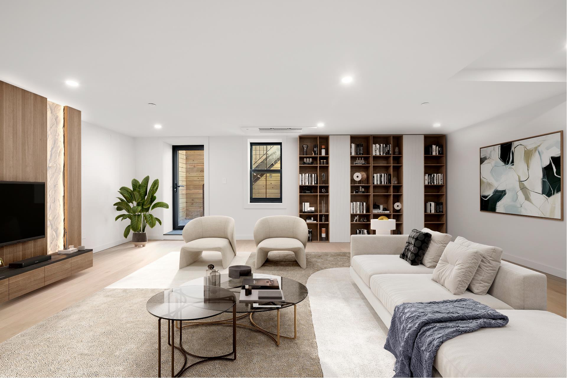 a living room with furniture potted plant and a flat screen tv