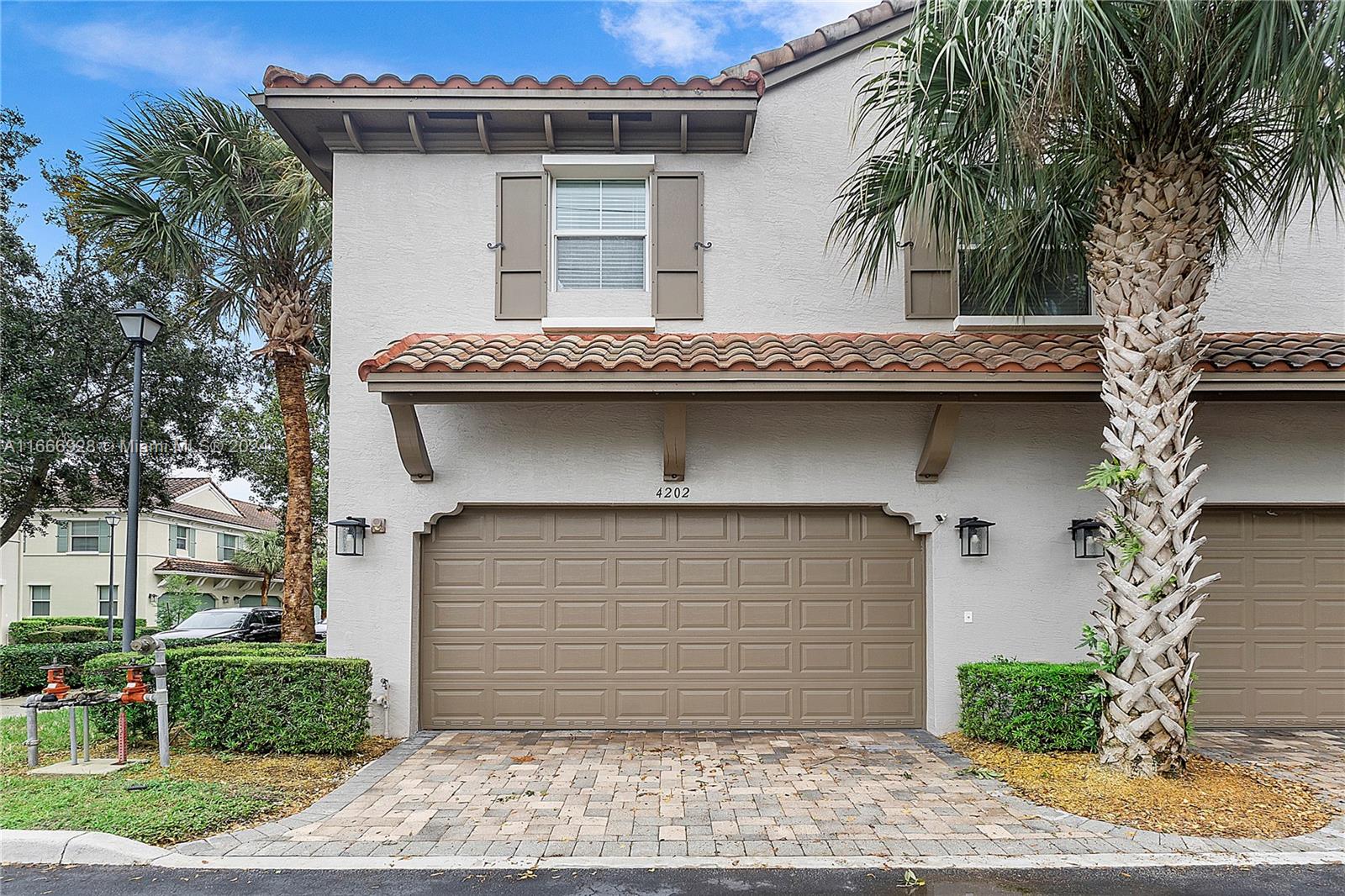 a front view of a house with garage