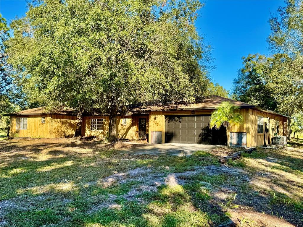 front view of a house with a big yard