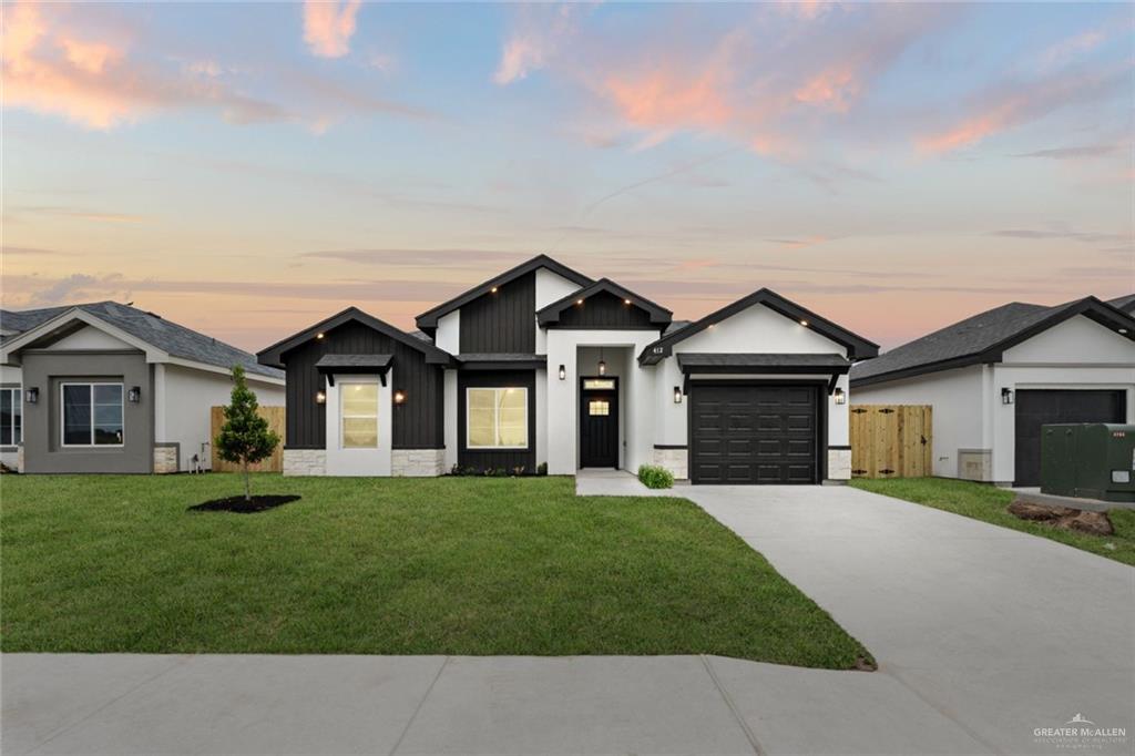 front view of a house with a yard