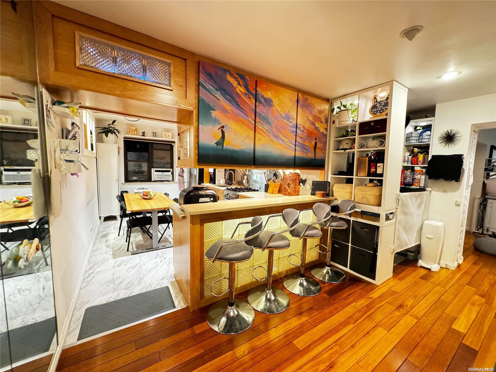 a room with lots of wooden furniture and a table