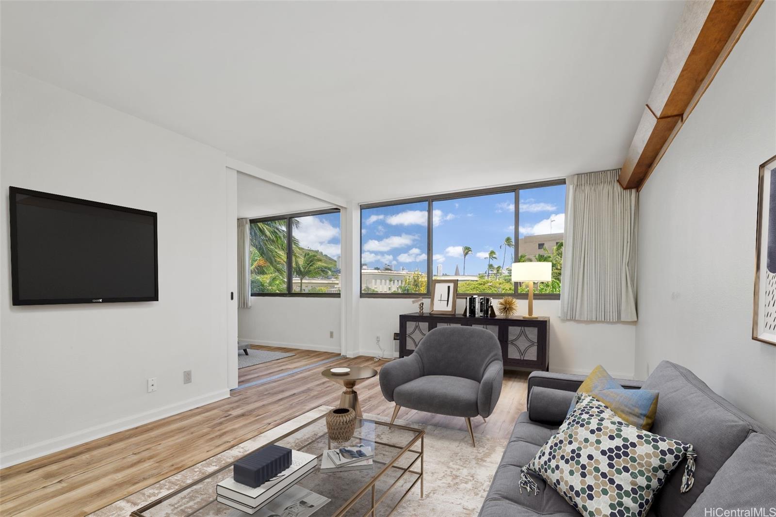 a living room with furniture and a flat screen tv