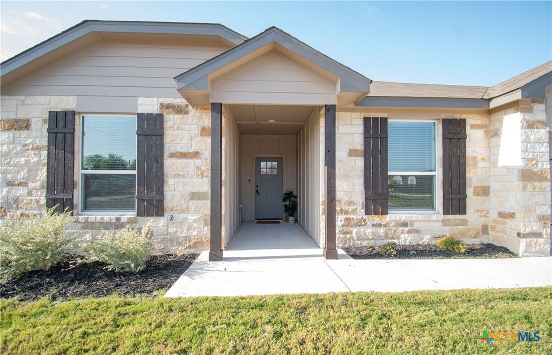 front view of a house with a yard